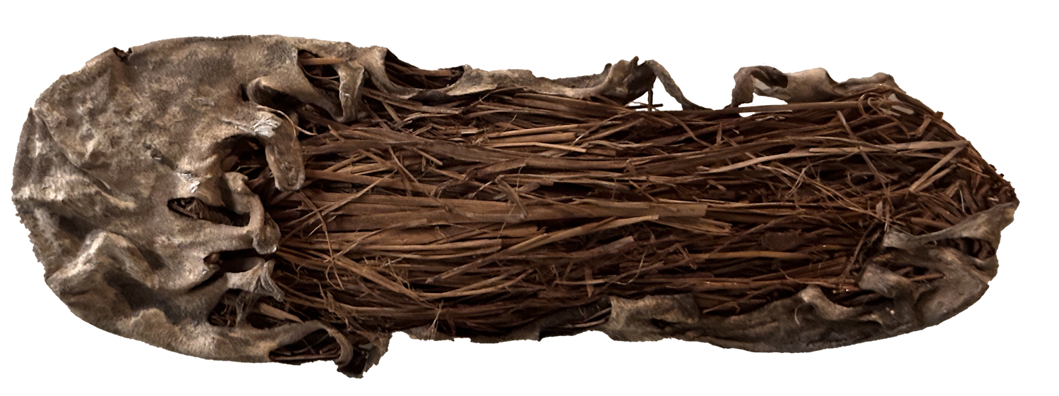 A small leather and grass shoe from 8,000 years ago.